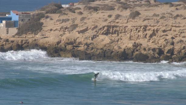 istock Anonymous Surfer Surfing Clean Wave on Atlantic Ocean in Morocco 1644320103