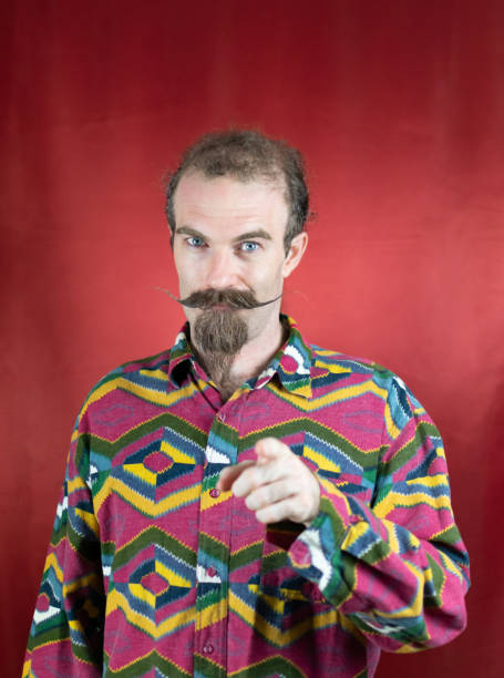 istock Hipster man confident showing approbation and pointing with finger at camera 1644323826