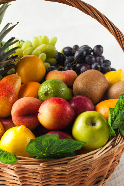 istock Basket with ripe exotic fruits. Harvesting. 1644328384