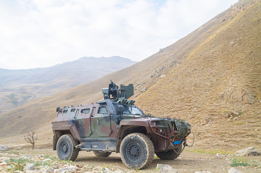 An armoured personnel carrier (APC) is a broad type of armoured military vehicle designed to transport personnel and equipment in combat zones. Since World War I, APCs have become a very common piece of military equipment around the world.