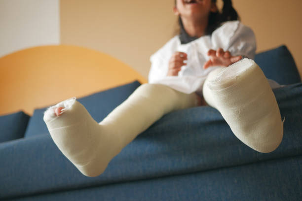 istock child with plaster bandage on leg. 1644348851