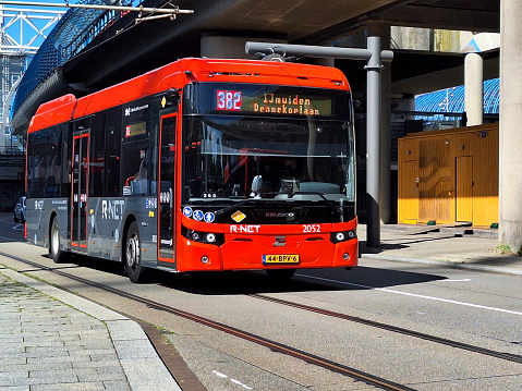 Black and red Ebusco 2.2  buses of Connexion in R-Net colors at Amsterdam Sloterdijk in the Netherlands