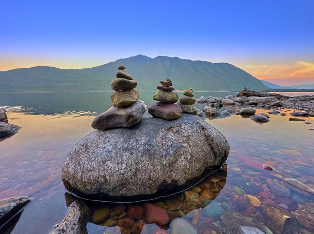 Rocks stacked on a large boulder at Glacier National Park, MT.