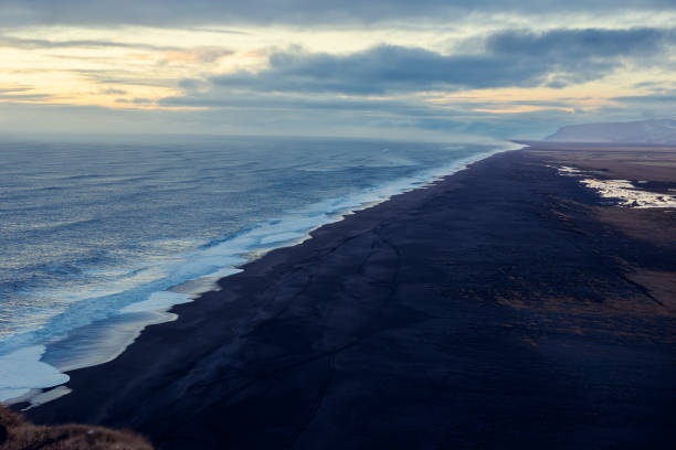 istock Northern shoreline with black sand beach 1644359621