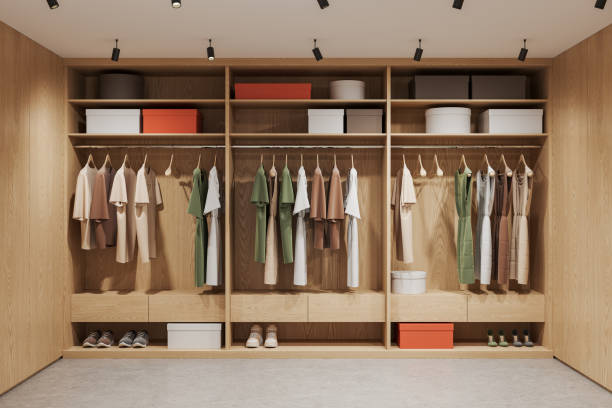 istock Light wooden walk in closet interior with wardrobe 1644359635