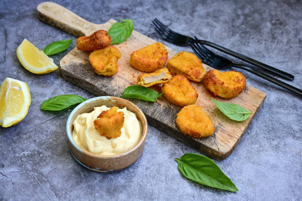 istock Crispy oven baked  chicken nuggets 1644369852