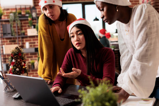 istock Team discussing report on xmas 1644378734