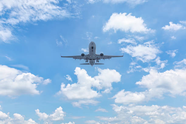 istock Commercial airplane flying in blue sky 1644380751