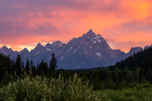 Grand Teton Stands Proud Over The Lower Areas Of The Park At Sunset in Summer