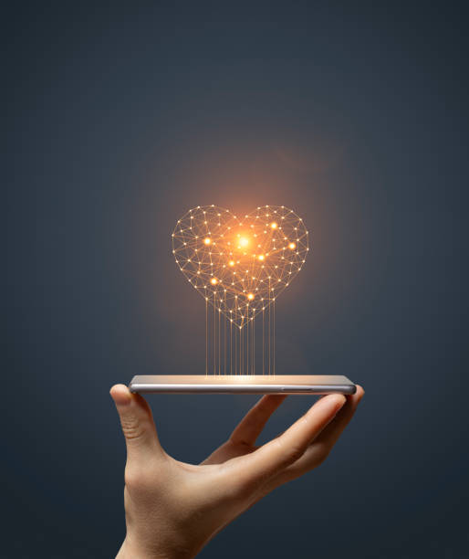 istock Idea concept with hand holding smartphone with glowing light bulb 1644384457