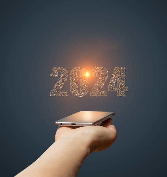 istock 2024 new year day artificial intelligence concept with hand holding smartphone 1644386210