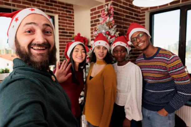 istock Employees taking christmas selfie 1644387362
