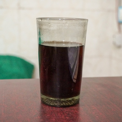 A glass of black tea for boosting energy and refreshment.