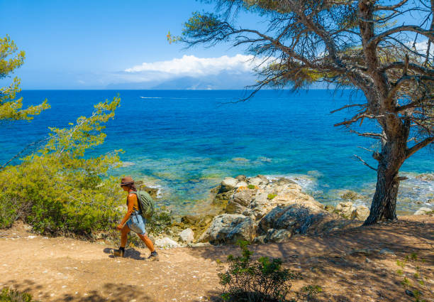 Corse, France - 2 July 2023 - Corsica is a big touristic french island in Mediterranean Sea, beside Italy, with beautiful beachs and mountains. Here the beach named Plage de Lotu in desert Agriate, with tourists
