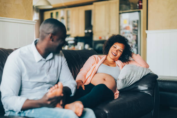 istock Husband massaging his wife's feet 1644394966