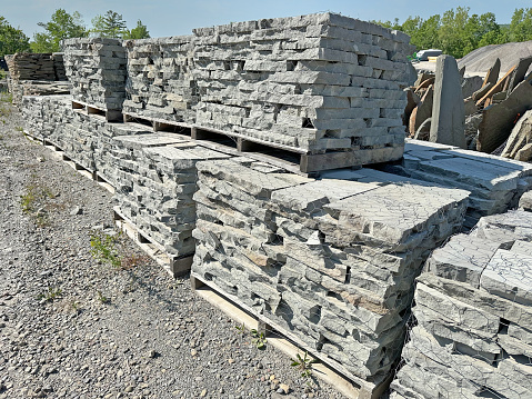 Repair of an old stone wall to a new red brick wall. Beautiful interesting interactive texture. Section of the new and old.