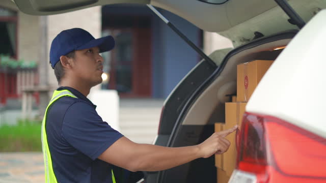 Delivery manstanding for checking inventory to prepare delivery to customer.