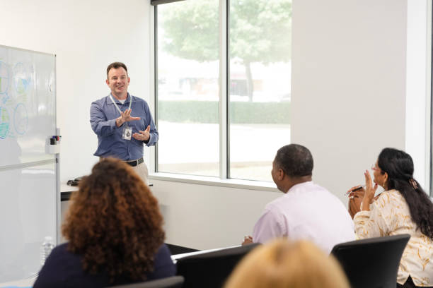 istock Mature man lectures to diverse class of unrecognizable adult students 1644407106