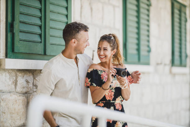 istock Couple Using Digital Camera And Enjoying Summer Vacation 1644407110