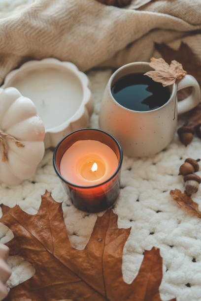 istock Burning candle in home interior, autumn mood 1644414623