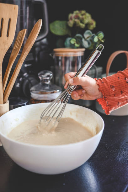 istock Kneading dough for pancakes, cooking homemade breakfast 1644416199