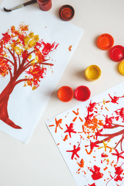 istock Children's creativity, autumn drawing with paints close-up 1644417834