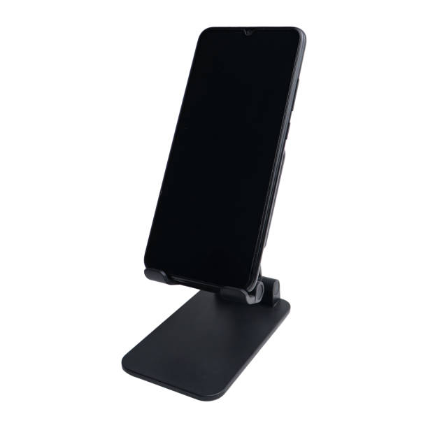 istock Smartphone on stand holder isolated on white background 1644445782