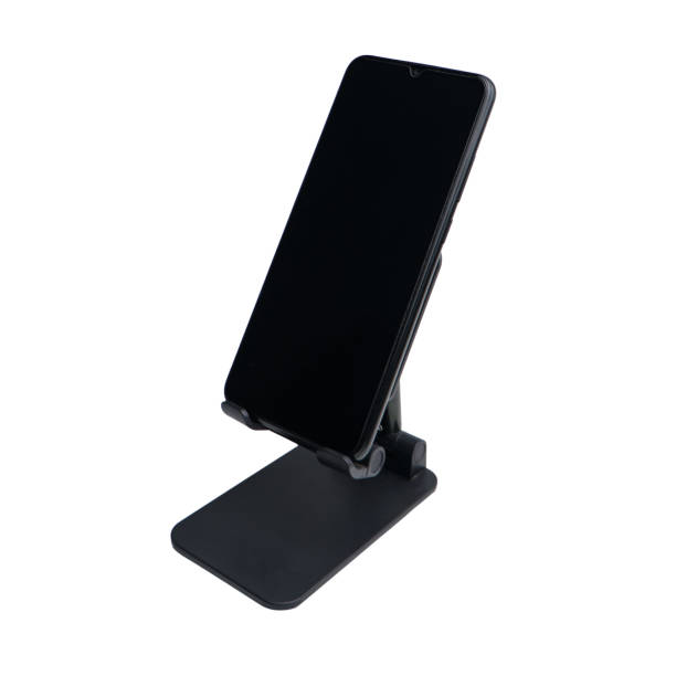 istock Smartphone on stand holder isolated on white background 1644446346