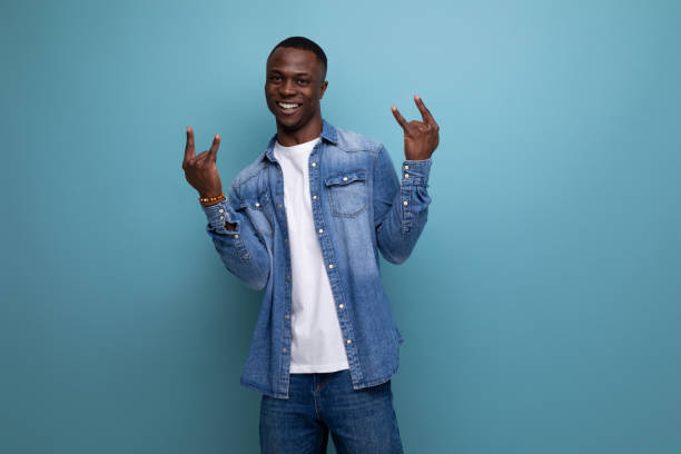 istock young joyful with dark skin american guy dressed stylishly in jeans isolated studio background 1644458053