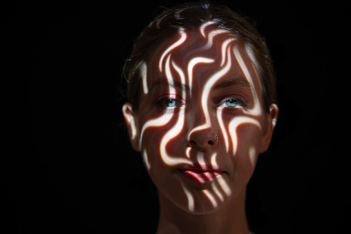 Light on young woman's face.