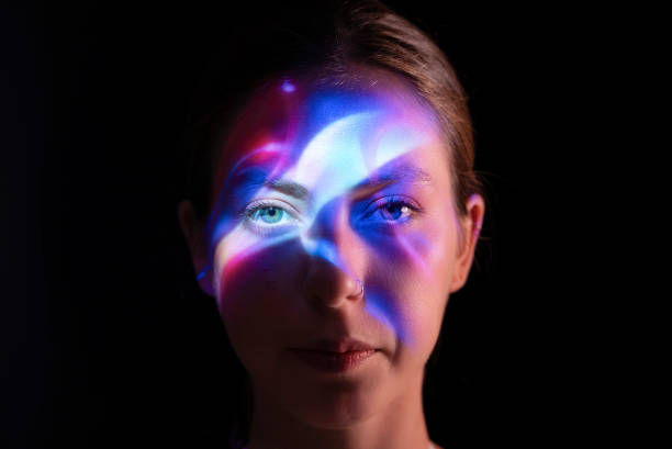 istock Colorful lights on woman's face 1644465999