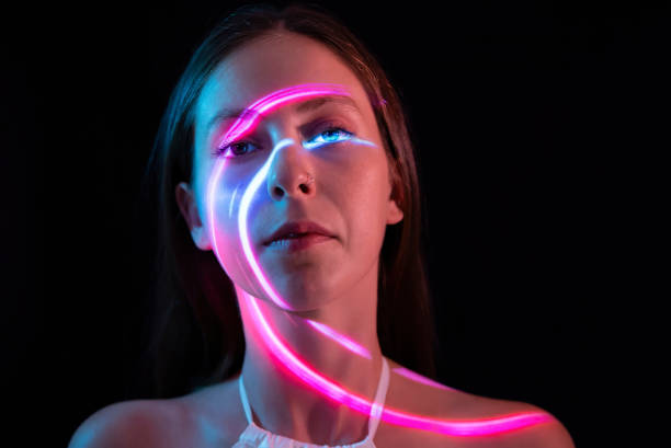 istock Pink circle of light on woman's face 1644466045