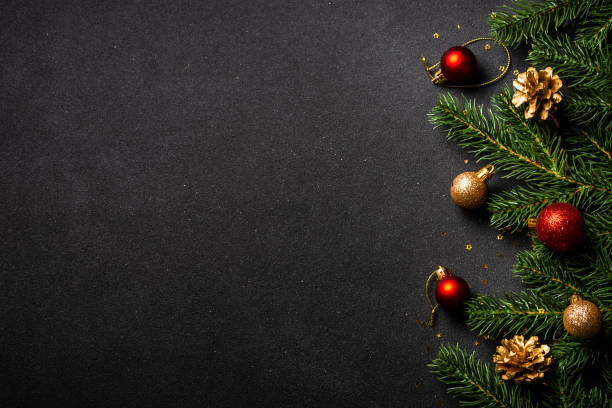 istock Christmas flat lay background with holiday decorations on black. 1644468466