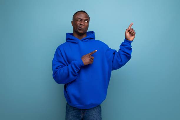 istock a handsome short-haired brunette African in a basic hoodie demonstrates the mind and resourcefulness of an idea 1644468485