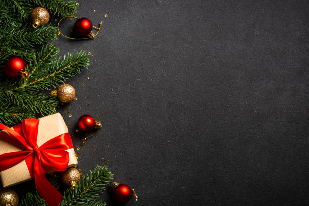 istock Christmas flat lay background with holiday decorations on black. 1644468495