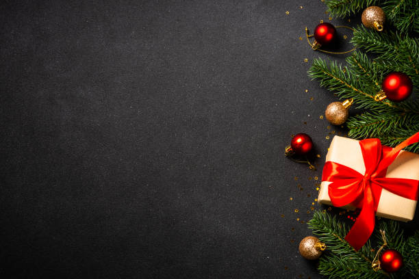 istock Christmas flat lay background. Present box, fir tree and holiday decorations. 1644468501