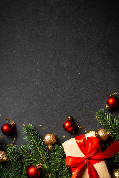 istock Christmas flat lay background. Present box, fir tree and holiday decorations. 1644468512
