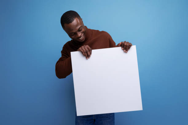 istock young african male student demonstrating his thesis using a whiteboard with mockup 1644468535