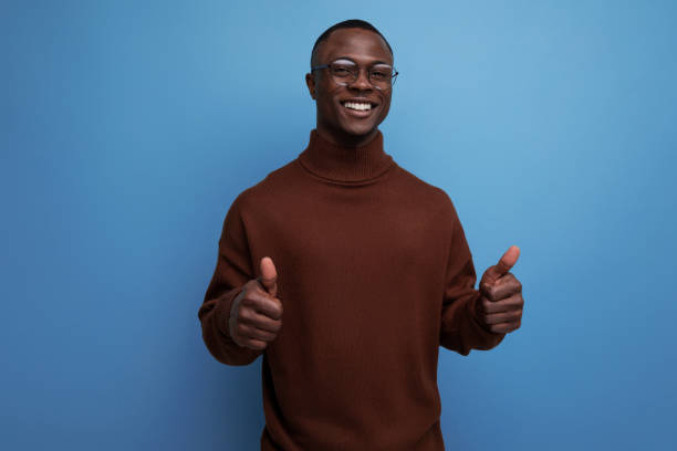 istock handsome young african guy in an elegant look on a studio background with copy space 1644468550
