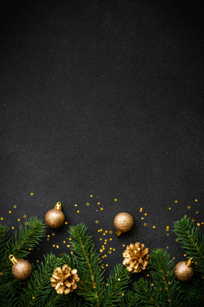 istock Christmas flat lay background with holiday decorations on black. 1644468714