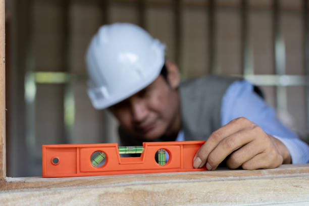 istock Contactor or engineer is inspecting construction and quality assurance new house using a level. Engineers or architects or contactor work to build the house before handing it over to the homeowner 1644474310