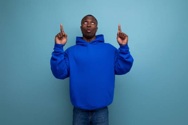 istock a handsome short-haired brunette African in a basic hoodie demonstrates the mind and resourcefulness of an idea 1644476728