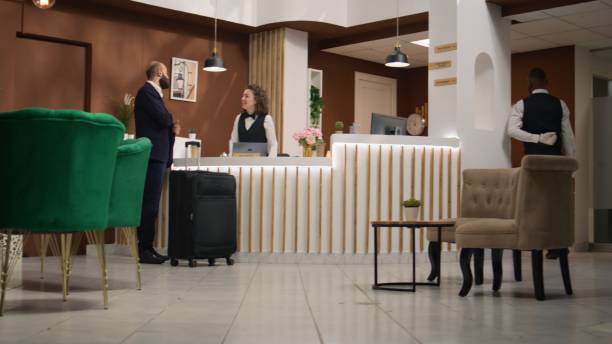 istock Entrepreneur arriving at hotel reception 1644483327