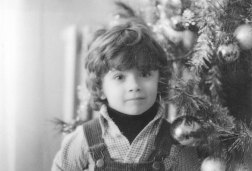 Little Boy under Christmas Tree in 1964.