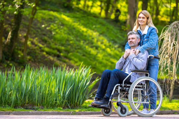istock Happy smiling couple on a walk in the park 1644484429