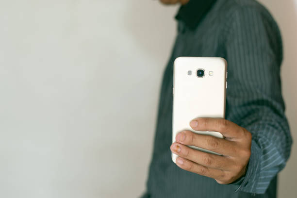 istock Close-up shot of man's hand using mobile phone, smartphone, working and talking. business idea 1644484433