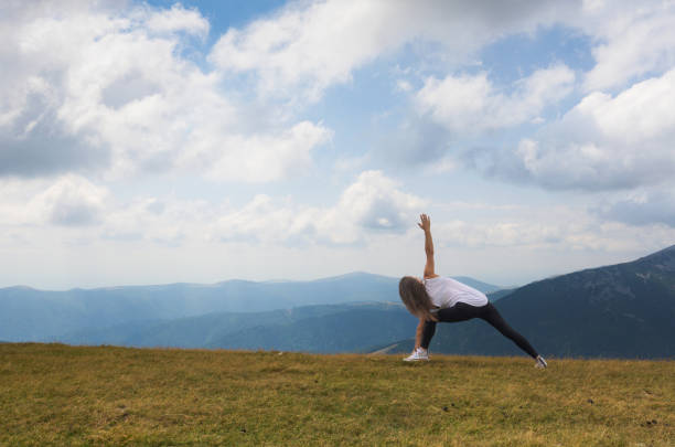istock Yoga and meditation program in nature. 1644486931