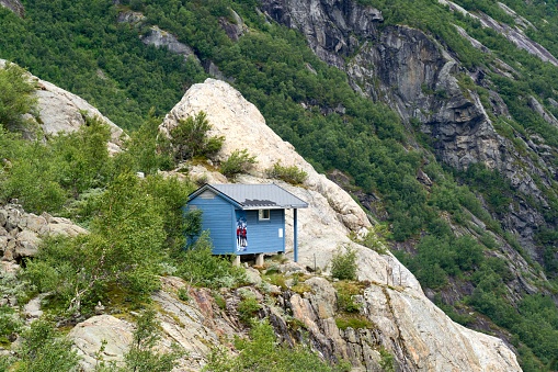 An old blue wooden hut on Boarbreen viewpoint, Odda, Norway