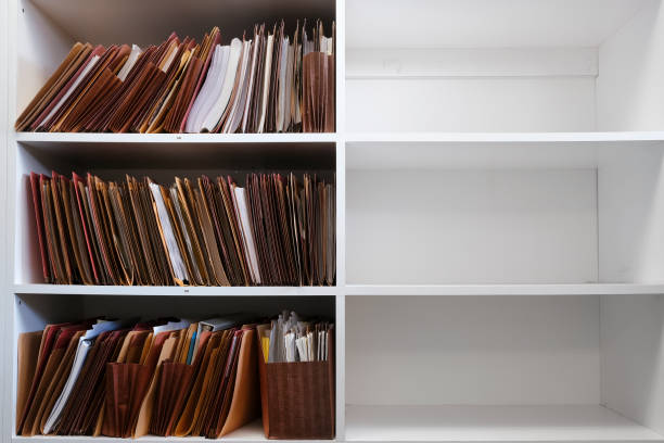 istock Files Organized on Office Shelf For Clients Papers and Information 1644487109