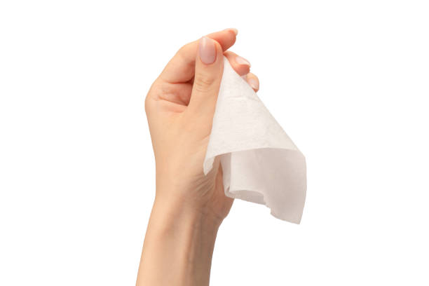istock Wet wipe in a woman hand isolated on a white background. 1644488046